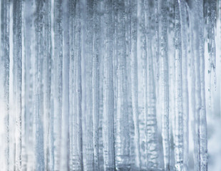 Background with icicles in shades of blue