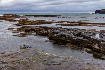 Surrounding the seaside town of Kilkee, County Clare, Ireland are interesting cliffs with many unique rock formations