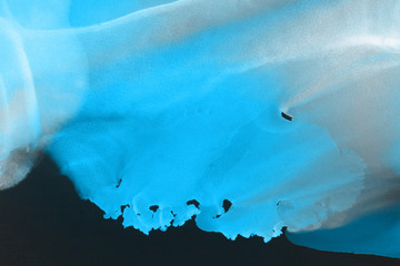 Hand painted blue alcohol ink background. Abstract delicate winter season texture. Contemporary wallpaper. 