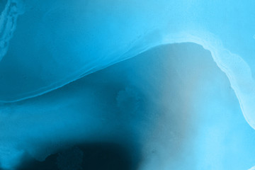 Fototapeta premium Hand painted blue alcohol ink background. Abstract delicate winter season texture. Contemporary wallpaper. 