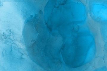 Hand painted blue alcohol ink background. Abstract delicate winter season texture. Contemporary wallpaper. 