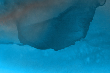 Hand painted blue alcohol ink background. Abstract delicate winter season texture. Contemporary wallpaper. 