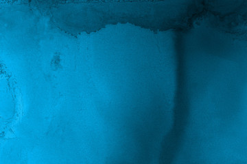 Hand painted blue alcohol ink background. Abstract delicate winter season texture. Contemporary wallpaper. 