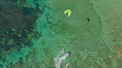 Aerial drone photo of kite surfers practising in famous bay of Loutsa or Artemida, Attica, Greece