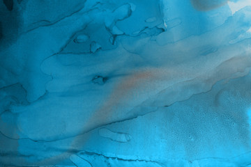 Hand painted blue alcohol ink background. Abstract delicate winter season texture. Contemporary wallpaper. 