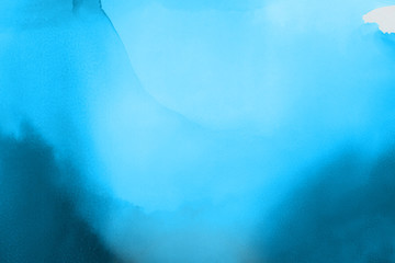 Hand painted blue alcohol ink background. Abstract delicate winter season texture. Contemporary wallpaper. 