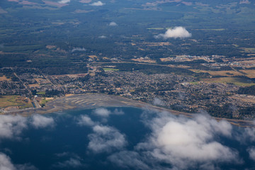Obraz premium Aerial view of a small town, Parksville, on Vancouver Island during a sunny summer morning. Taken near Nanaimo, British Columbia, Canada.