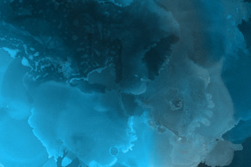 Hand painted blue alcohol ink background. Abstract delicate winter season texture. Contemporary wallpaper. 