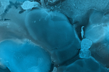Hand painted blue alcohol ink background. Abstract delicate winter season texture. Contemporary wallpaper. 