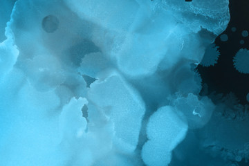 Hand painted blue alcohol ink background. Abstract delicate winter season texture. Contemporary wallpaper. 