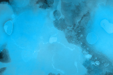 Hand painted blue alcohol ink background. Abstract delicate winter season texture. Contemporary wallpaper. 