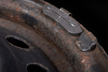 Lead weights on the rim. Accessories for the vulcanizer in the workshop.