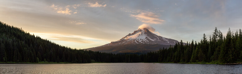 Beautiful Panoramic Landscape View of Mt Hood during a dramatic cloudy sunset. Taken from Trillium Lake, Mt. Hood National Forest, Oregon, United States of America.