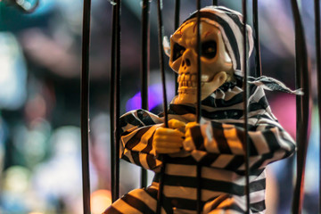 Skull in a cage. Halloween decoration