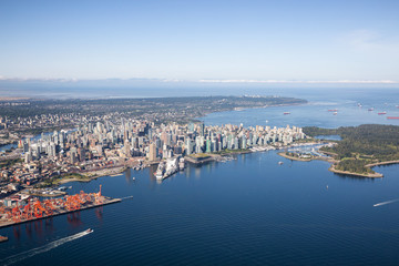 Fototapeta na wymiar Aerial view of Downtown City, Port and Harbour in Vancouver, British Columbia, Canada. Taken during a sunny summer morning.