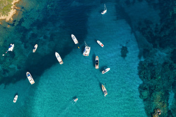 View from above, stunning aerial view of a beautiful bay full of boats and luxury yachts. A...