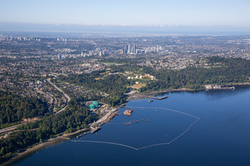 Aerial view of Oil Refinery Industry in Port Moody, Greater Vancouver, British Columbia, Canada. Taken during a sunny summer morning.