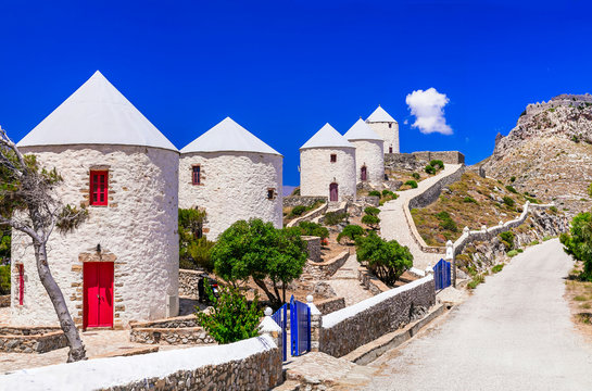 Mediterranean Aesthetics of Greece: Row of Traditional White Windmills in Leros Island, Panteli Village Overlooking Aegean Sea, Iconic Dodecanese Landscape, Summer Travel Concept 4K High Resolution