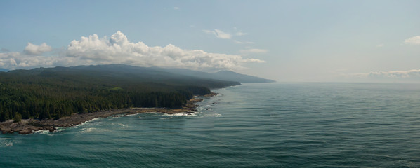 Beautiful Aerial Panoramic Landscape View of the Rocky Pacific Ocean Coast in the Southern Vancouver Island during a sunny summer day. Taken between Victorial and Port Renfrew, BC, Canada.