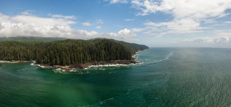 Beautiful Aerial Panoramic Landscape View of the Rocky Pacific Ocean Coast in the Southern Vancouver Island during a sunny summer day. Taken between Victorial and Port Renfrew, BC, Canada.