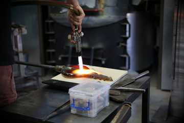 man working in glass factory