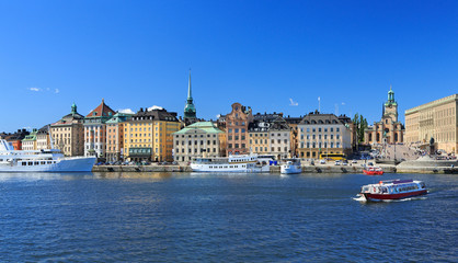 Scenic view of Stockholm's Old Town (Gamla Stan) with a passenger ship on the foreground, Sweden