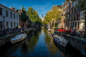 Fototapeta na wymiar Boats on canal in Amsterdam, Netherlands