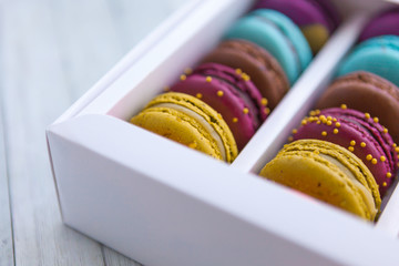 Colored macaroons in a white box, close-up