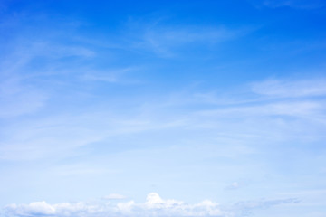 Blue sky background and white clouds soft focus, and copy space
