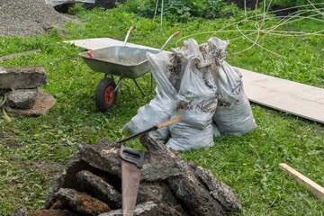 construction waste, transport trolley and other tools are located on the territory of a private...