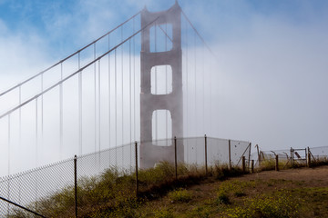 Foggy morning on the Golden Gate- ugly fence ruining the view of the bridge for tourists 