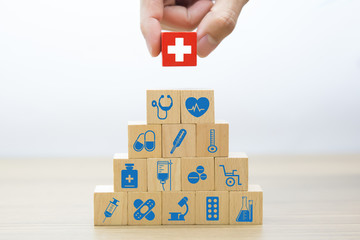 Wood block Stacking with Medical and Health Concept.