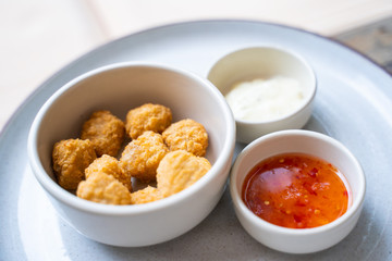 deep fried chicken nuggets with spicy sauce