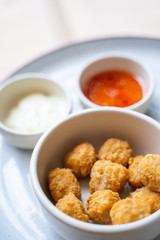 deep fried chicken nuggets with spicy sauce