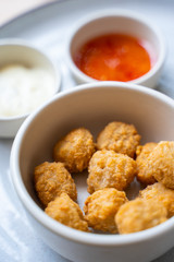 deep fried chicken nuggets with spicy sauce