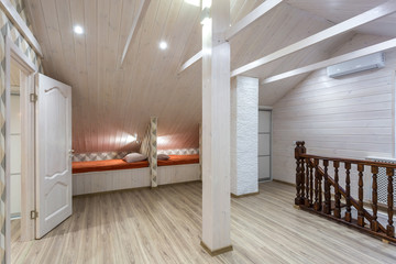 rows of wooden beds in a modern eco hostel with amenities