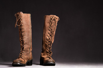 Close up of beautiful, stylish leather boots, in a lace up style, like a fantasy story.