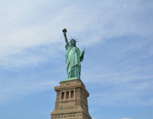 Naklejka na ściany i meble statue of liberty in New York with blue sky