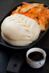 Close-up of korean steamed pjan-se or tin-pun, selective focus, vertical shot