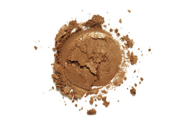 Bronzer or eye shadow texture. Crashed nude brown shimmer face powder swatch isolated on white background