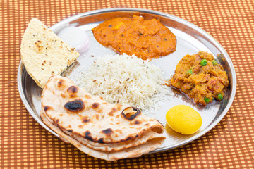 Indian Traditional Special Thali Food Also Know as Punjabi Thali, North Indian Thali or Indian Veg Thali Makes For The Perfect Assortment of Delicious Regional Dishes on a Single Platter