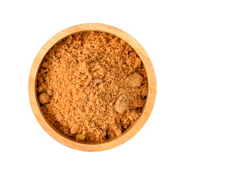 Brown sugar in wood bowl on white background