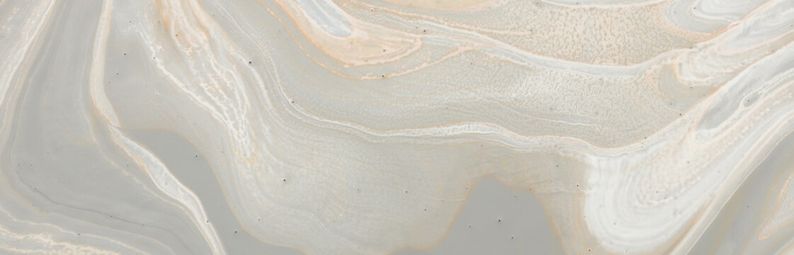 photography of abstract marbleized effect background. gray, gold and white creative colors. banner