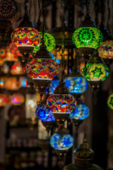 Fototapeta na wymiar Traditional colorful decorative Turkish oriental lamps for sale in at a souvenir shop in Kotor old town in Montenegro