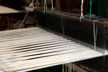 Traditional loom in Antigua Guatemala, means of economic income, family tradition and ancestral culture typical designs of textiles.