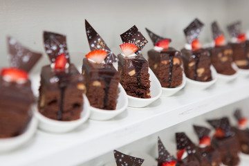 Selective focus of  Many chocolate cakes on the shelves
