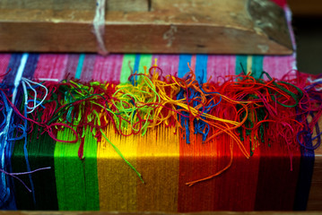 Traditional loom in Antigua Guatemala, means of economic income, family tradition and ancestral culture typical designs of textiles.