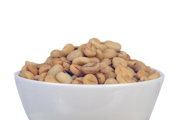 Raw coffee beans in coffee cup on open space.