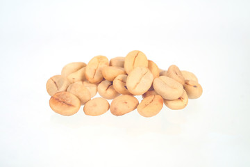 Fresh Raw coffee beans on white background.
