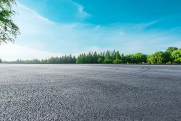 Foto op Canvas Asphalt race track and green woods nature landscape in summer © ABCDstock